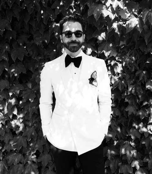 Sterling Derk at his own wedding in a Tagliatore dinner jacket