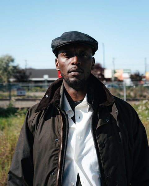 Barbour Olive Classic Bedale wax jacket and Black Cheviot waxed flat cap, photographed in Edmonton