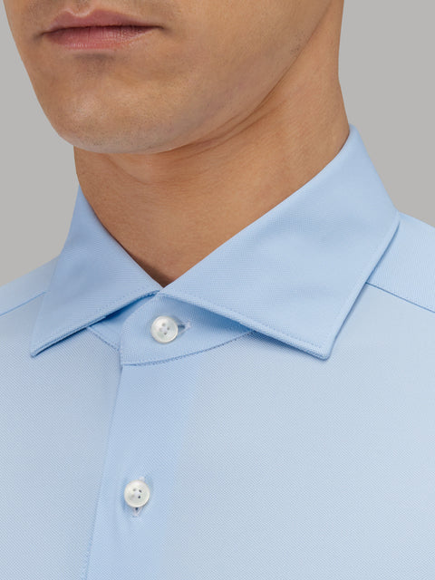 Blue Xacus 11460 Active dress shirt back view showing curved hem