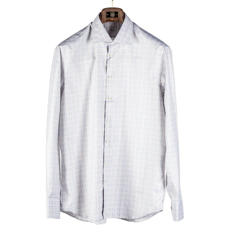 A long-sleeve button-up dress shirt with a fine light blue and white checkered pattern, hanging on a wooden hanger against a light gray background.