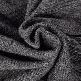 Drake's grey merino knit in close detail, showing the fine gauge and the ribbed trim.