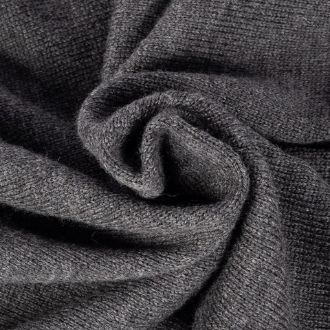 Drake's grey merino knit in close detail, showing the fine gauge and the ribbed trim.