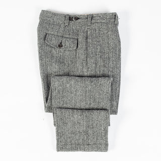Drake's Harris Tweed One Pleat Games Trousers folded flat to show the taper and the turn-ups.