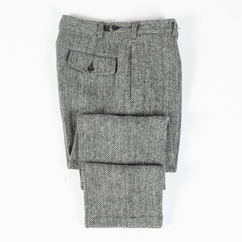 Drake's Harris Tweed One Pleat Games Trousers folded flat to show the taper and the turn-ups.