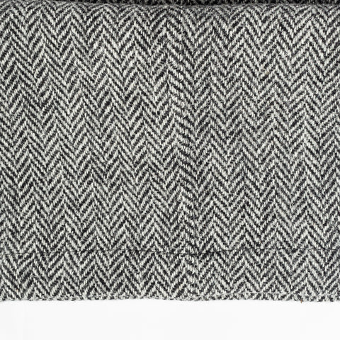 Close detail of the grey herringbone Harris Tweed used for Drake's One Pleat Games Trousers.