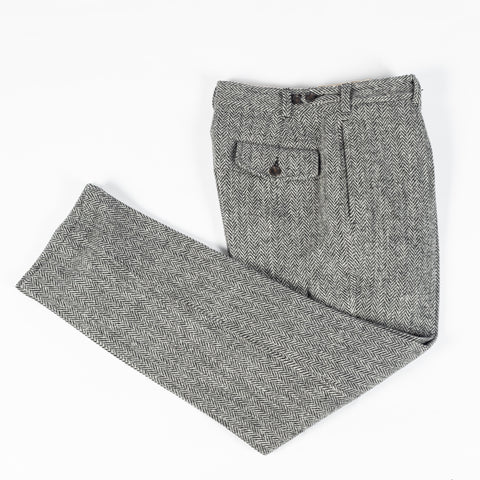 Drake's Harris Tweed One Pleat Games Trousers laid folded, showing the back pocket and leg line.