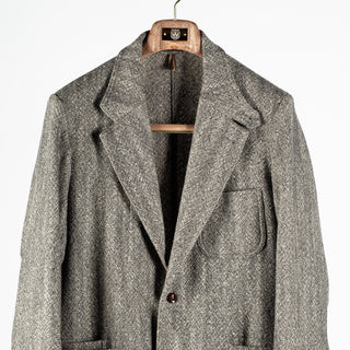 Drake's Black and White Tweed Western Games Blazer, notch lapel and patch chest pocket in close view.