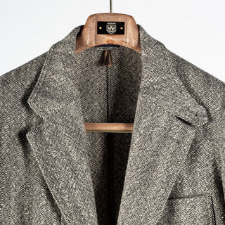 Drake's Black and White Tweed Western Games Blazer with the collar opened to show the cloth.