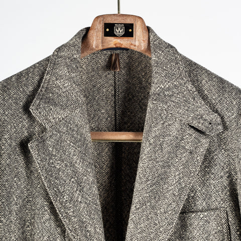 Drake's Black and White Tweed Western Games Blazer with the collar opened to show the cloth.