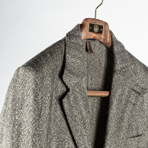 Drake's Black and White Tweed Western Games Blazer, lapel roll and soft natural shoulder on the hanger.
