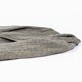 Drake's Black and White Tweed Western Games Blazer folded on a white ground to show the tweed surface.