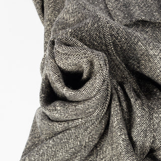 The salt and pepper tweed of Drake's Western Games Blazer gathered to show its weight and hand.