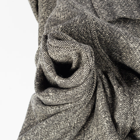 The salt and pepper tweed of Drake's Western Games Blazer gathered to show its weight and hand.