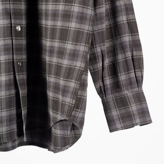 Drake's Grey Long Point Two Pocket Check Shirt, curved hem and buttoned cuff seen up close.