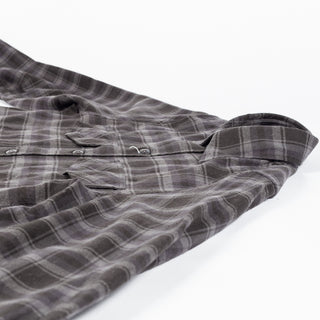 Drake's Grey Long Point Two Pocket Check Shirt laid down, showing the placket and chest pocket.