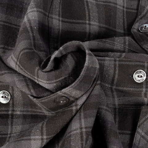 Close detail of the grey cotton and silk check cloth on Drake's Long Point Two Pocket Shirt.