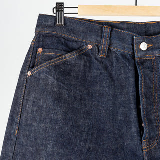 Drake's Indigo Rinse Selvedge Jeans, slanted front pocket with copper rivets in close view.