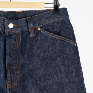 Drake's Indigo Rinse Selvedge Jeans, front waistband, fly and coin pocket seen up close.