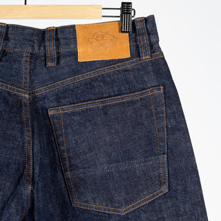 Drake's Indigo Rinse Selvedge Jeans, leather waistband patch above the back pocket.