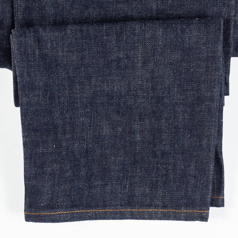 Close detail of the 14.2 oz Japanese selvedge denim and hem stitching on Drake's five-pocket jeans.