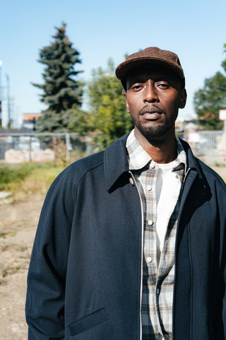 De Bonne Facture Navy Driver'\''s Jacket in water-repellent wool and cotton twill, worn open over a checked flannel shirt