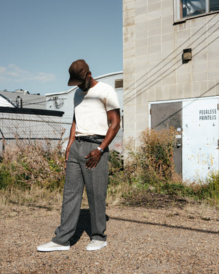 Merz b. Schwanen Nature 215 loopwheeled midweight t-shirt worn with grey herringbone trousers and a brown wool cap
