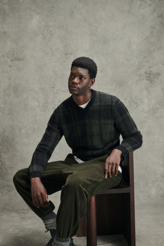 Barbour Black Tartan Hunham Knit styled in the Barbour autumn winter 2026 campaign.