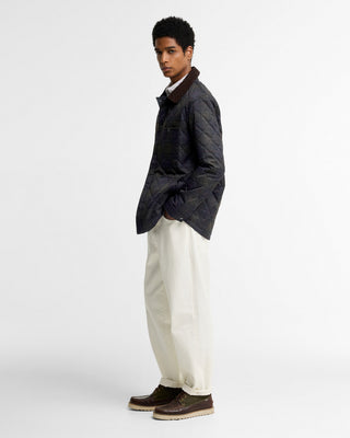 Barbour Shadow Tartan Quilt Overshirt worn by a model, full length view.