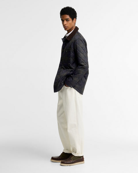 Barbour Shadow Tartan Quilt Overshirt worn by a model, full length view.