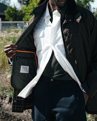 De Bonne Facture White Artist Shirt in cotton and hemp gabardine, placket detail under a waxed jacket
