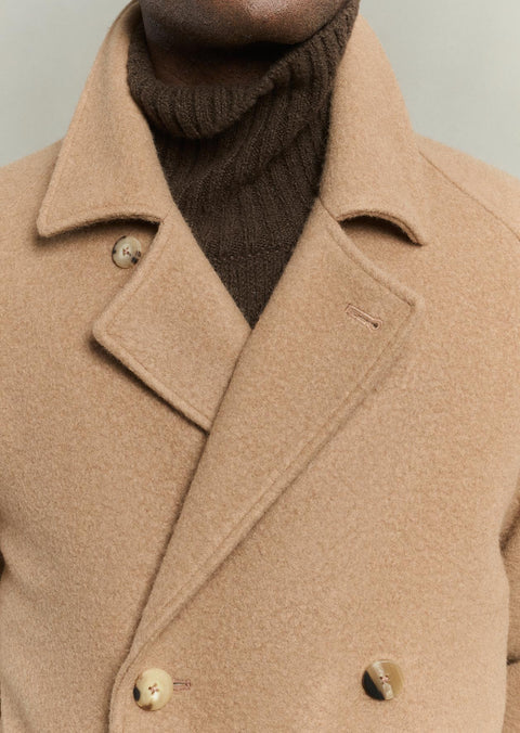 Close detail of the camel ratine lapel and horn buttons on the De Bonne Facture Grandad Coat