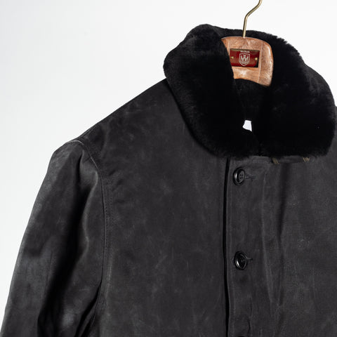 Black/Black waxed canvas N-1 Deck Jacket with black mouton collar, collar and shoulder
