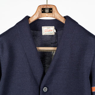 Dark navy wool Slouchy Varsity Cardigan with burnt orange sleeve stripes, neckline and Dehen label
