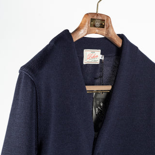 Dark navy wool Slouchy Varsity Cardigan with burnt orange sleeve stripes, neckline detail
