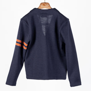 Dark navy wool Slouchy Varsity Cardigan with burnt orange sleeve stripes, back