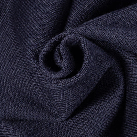 Dark navy wool Slouchy Varsity Cardigan with burnt orange sleeve stripes, knit close-up