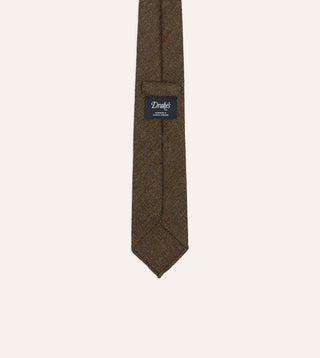Back of Drake's brown and black herringbone wool tie showing the Handmade in London, England label and self loop keeper.