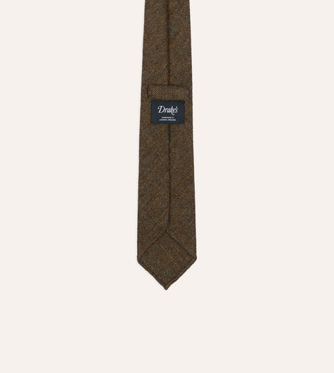 Back of Drake's brown and black herringbone wool tie showing the Handmade in London, England label and self loop keeper.