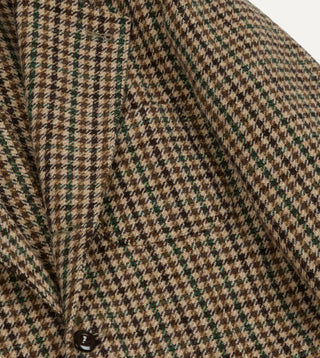 Front button and chest pocket of Drake's Brown and Green Houndstooth Tweed Games Blazer in close view.