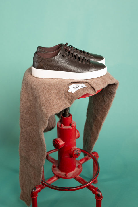 Fabiano Ricci TDM U1250 Grain Leather Sneaker resting on a shaggy lambswool knit